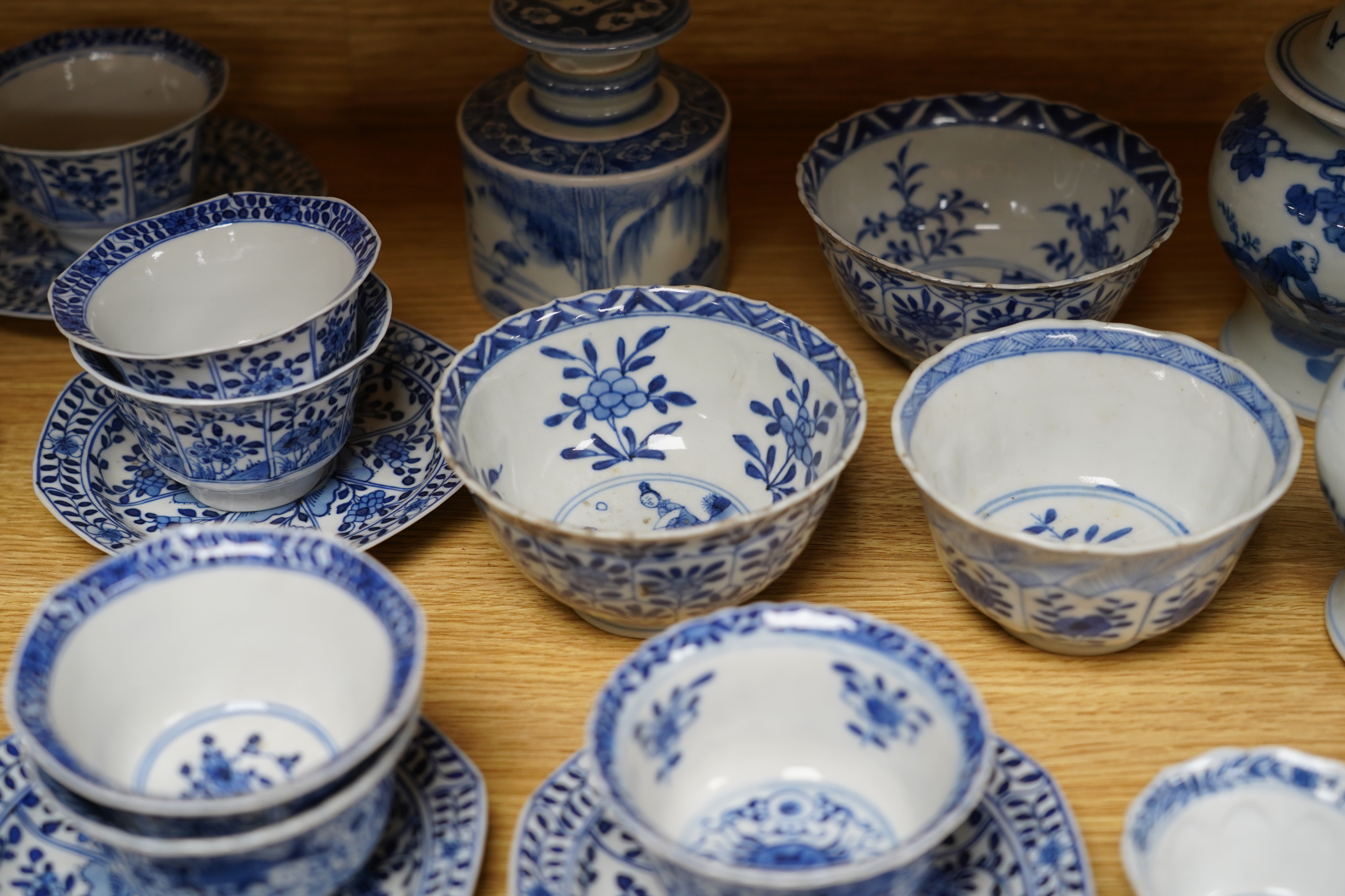 A quantity of 19th century Chinese blue and white porcelain including pair of baluster jars and covers and tea bowls, largest 14cm high